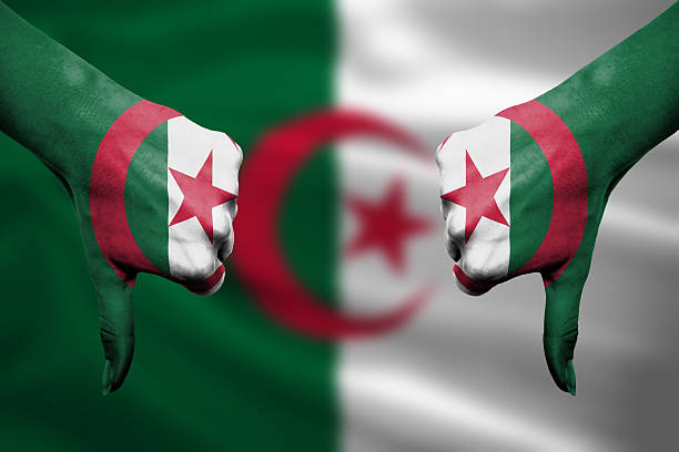 istock failure of Algeria - hands gesturing thumbs down 465974180
