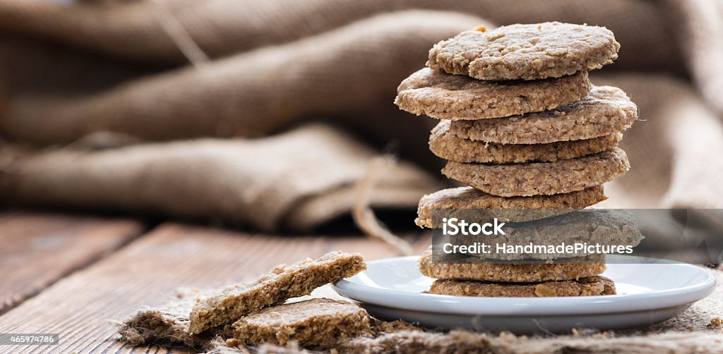 Portion of Oat Cookies Some Oat Cookies on rustic wooden background (close-up shot) 2015 Stock Photo