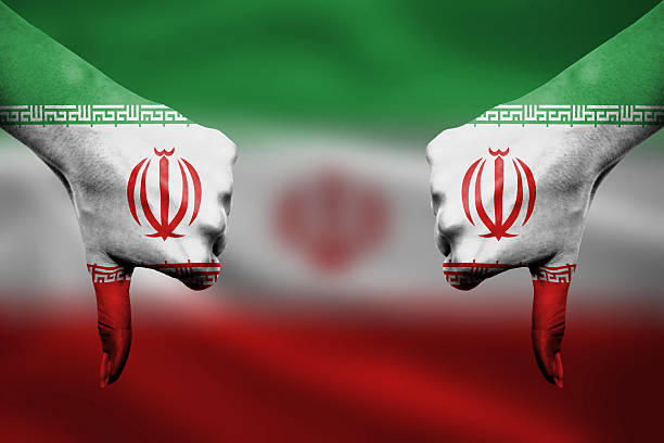 istock failure of Iran - hands gesturing thumbs down 465977374
