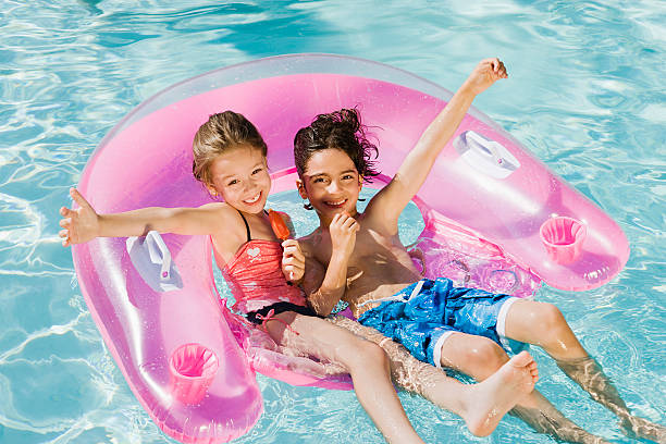 istock Friends Enjoying In Swimming Pool 465978050