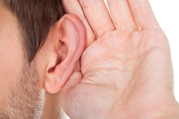 istock Close-up Of Hand Near Ear 465982495