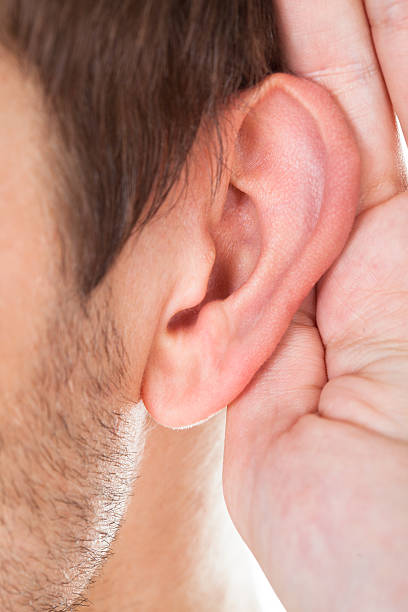 istock Close-up Of Hand Near Ear 465984855