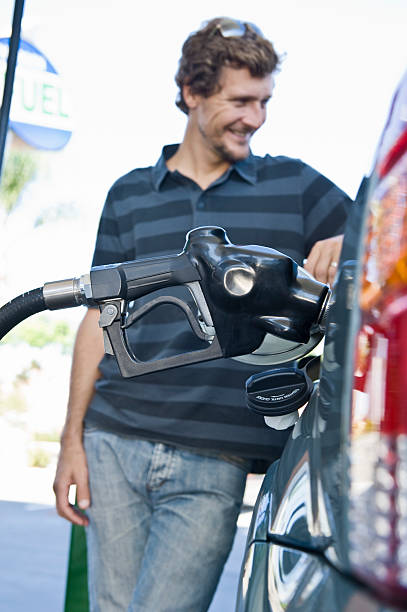 istock Man Refueling Car At Natural Gas Station 465984960