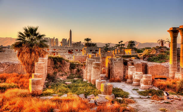 View of the Karnak temple in the evening - Egypt View of the Karnak temple in the evening - Luxor, Egypt luxor thebes photos stock pictures, royalty-free photos & images