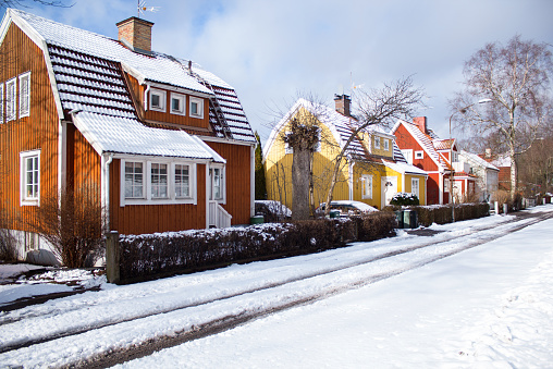 Swedish village houses on a snowy winter day, Stockholm, Enskede region