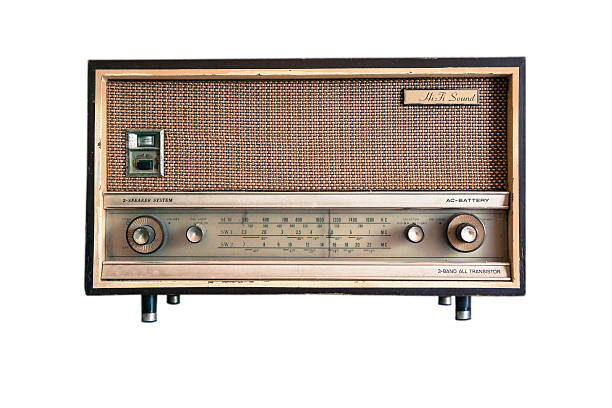Old Radios On Shelf In Illuminated Room