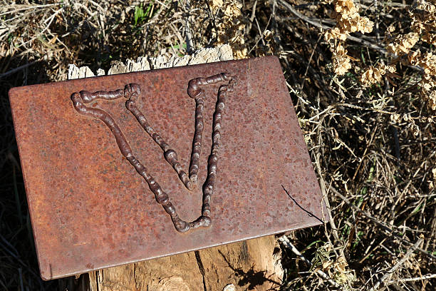 istock Letter V on a metal plate marking a trail 465986468