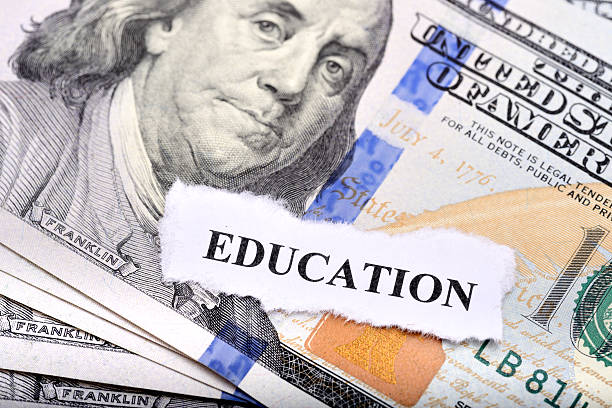 istock Education loan concept with dollar note and paper on foreground 465986854