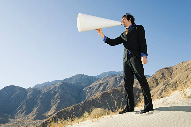 istock Businessman Yelling Through Megaphone 465987762