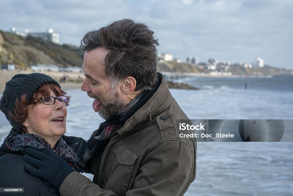 Huband about to lick his wife Husband jokingly about to like his wife Bournemouth - England Stock Photo