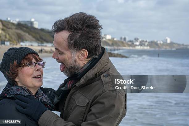 Huband About To Lick His Wife Stock Photo - Download Image Now - Bournemouth - England, 2015, 60-64 Years