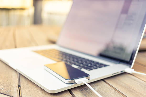 istock Smartphone being charged by a laptop 465992487
