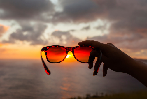 Hawaiian sunset through a sunglasses perspective.
