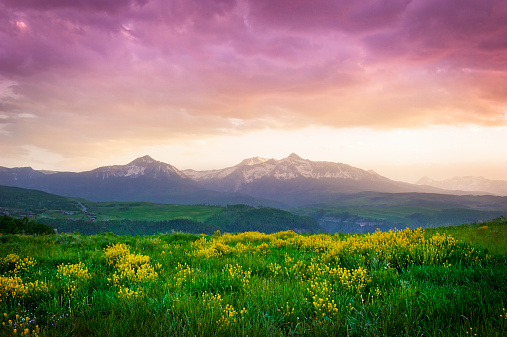 Sunset over a Colorado meadow and Mount Wilson in Telluride, Colorado