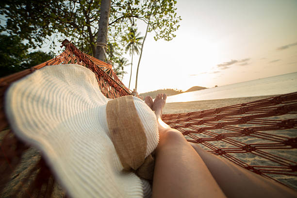 istock Woman's legs on hammock at tropical Island 465993666