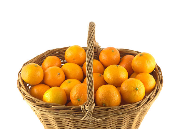 istock Tangerines in brown wicker basket isolated 465998513