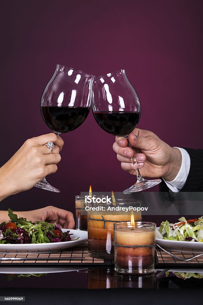 Couple Tossing Wine Glass Smiling Couple Tossing Wine Glass While Having Dinner Adult Stock Photo