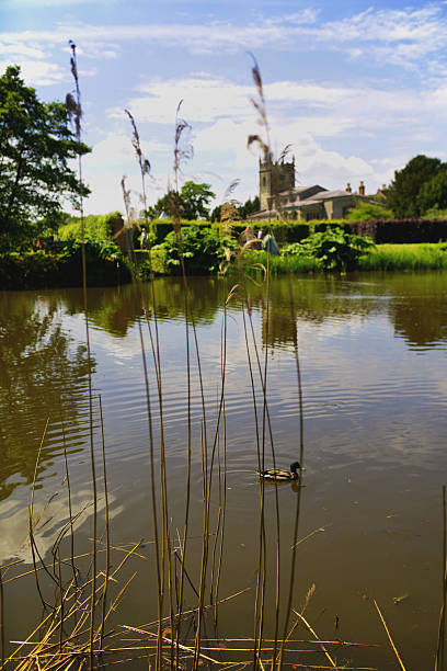 church a church reflected in a lake coughton stock pictures, royalty-free photos & images