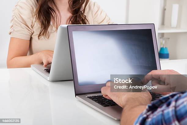 Couple Using Laptop Stock Photo - Download Image Now - Adult, Adults Only, Beautiful People