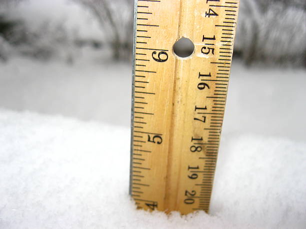 Measuring Snowfall with a Schoolhouse Ruler stock photo