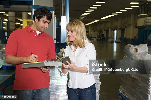 Workers Working In Newspaper Factory Stock Photo - Download Image Now - 2015, Adult, Calculator