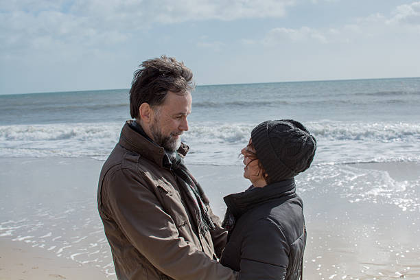 istock Couple embrace on the beach 466004178