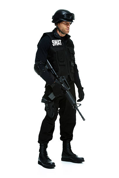 istock Police holding rifle and looking away 466004266