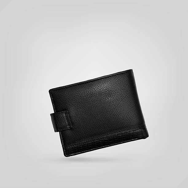 Black leather wallet Black leather wallet on gray background wallet photos stock pictures, royalty-free photos & images