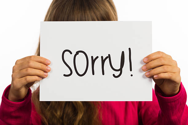 istock Child holding Sorry sign 466007348
