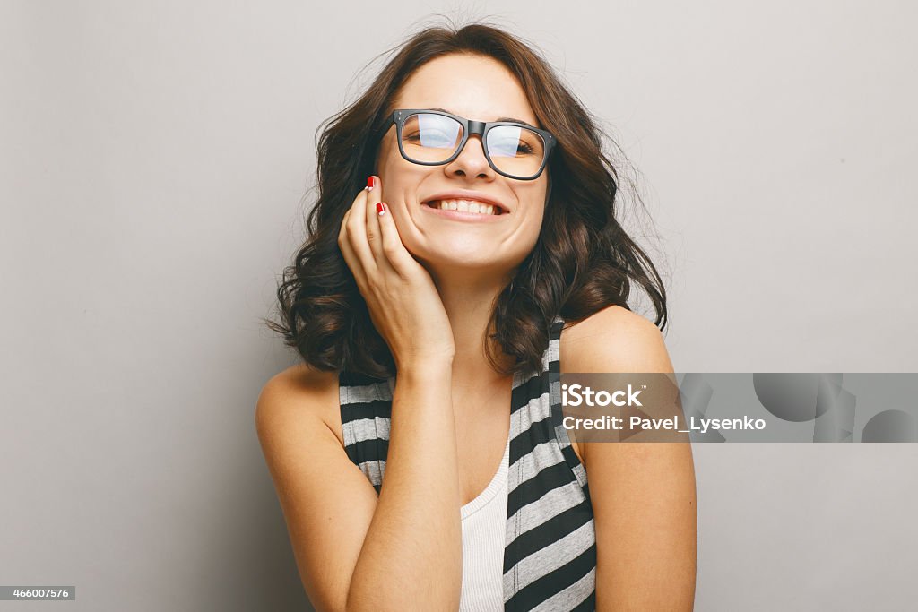 Portrait attractive woman on grey background. Portrait of a beautiful natural girl on a grey background. 2015 Stock Photo