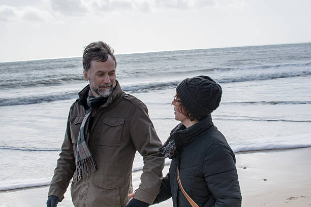 istock Retired couple look at each other at the beach 466007740