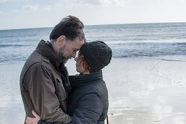 istock Couple embrace on the beach 466007758