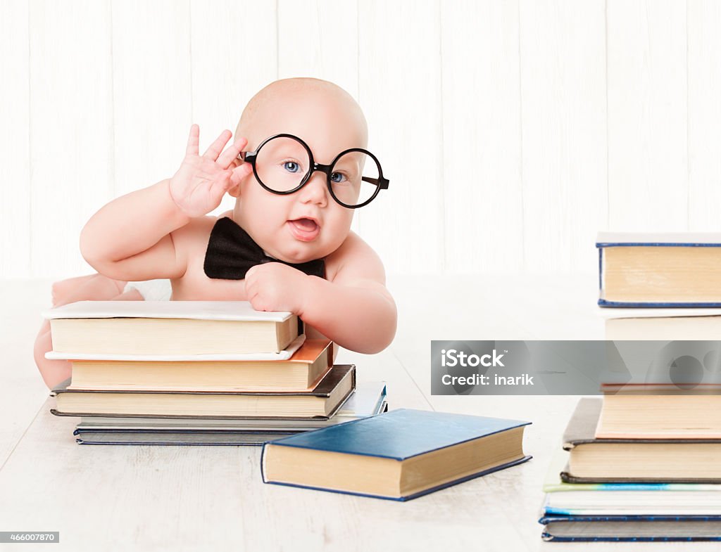 Baby Glasses Books, Preschool Kid, Early Childhood Education and Development Baby in Glasses and Books, Kids Early Childhood Education and Development, Smart Child Preschool Reading Concept, over White Background Book Stock Photo