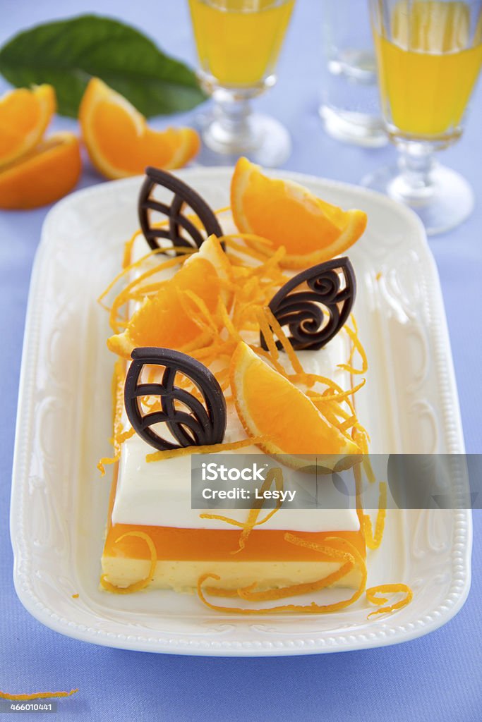 Creamy orange jelly with tangerines and chocolates. Blue Curacao Stock Photo