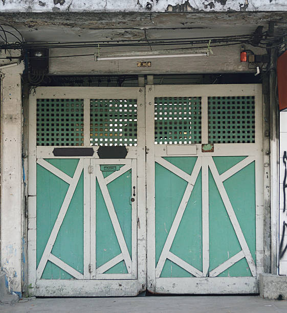 Green wooden door at Bangkok, Thailand