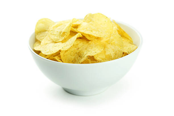 istock Potato chips in bowl isolated on white 466011660