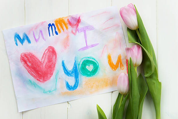 istock Drawing from Child for Mummy with Tulips nearby 466012394