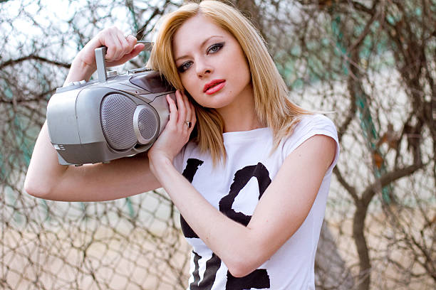 istock Girl with tape recorder 466012655