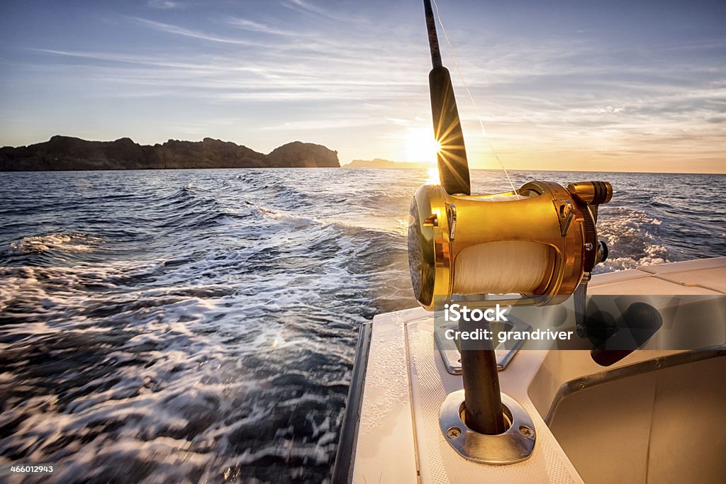 Ocean Fishing Reel On A Boat In The Ocean Stock Photo - Download Image Now  - Fishing, Fishing Industry, Nautical Vessel - iStock