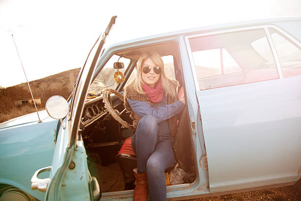 istock Woman sitting in a vintage car 466017527