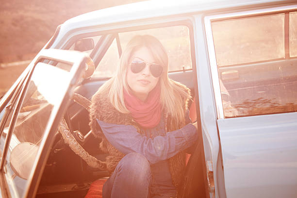 istock Woman sitting in a vintage car 466017529