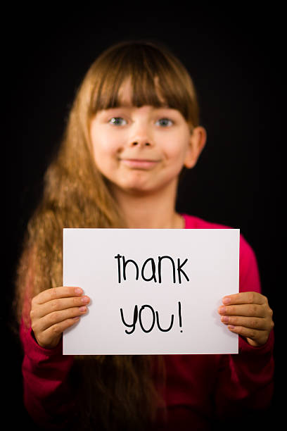 istock Child holding Thank You sign 466017602
