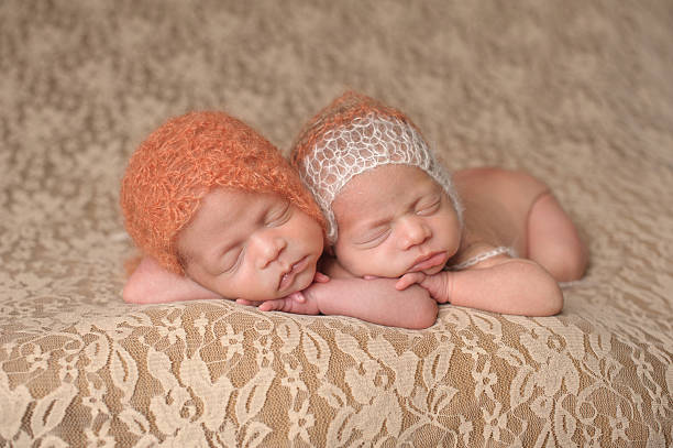 istock Sleeping Newborn Twin Girls 466017621