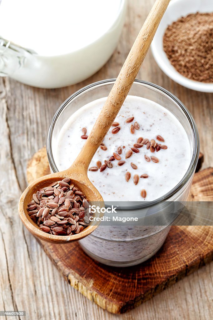 Glass of greek yogurt with crushed flax seeds Glass of greek yogurt with crushed flax seeds for healthy breakfast, top view Flax Seed Stock Photo