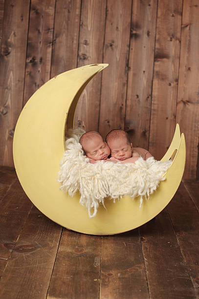 istock Sleeping Newborn Twin Girls 466017687