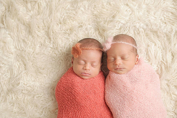 istock Sleeping Newborn Twin Girls 466017789