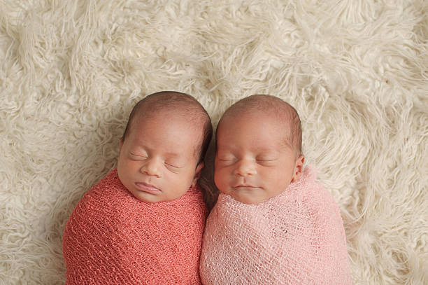 istock Sleeping Newborn Twin Girls 466018105