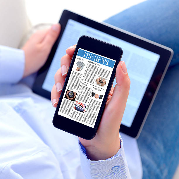 istock Reading news on smart phone 466018469