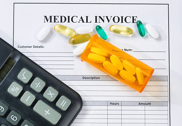 istock Medicine invoice with pills and calculator 466020930