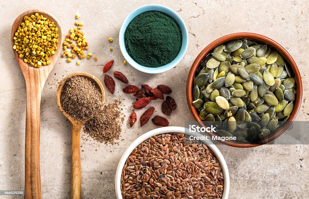 various superfoods on kitchen table various kinds of superfood on kitchen table for healthy breakfast, top view 2015 Stock Photo